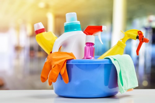 Cleaner handling upper-floor windows in the Ilford area