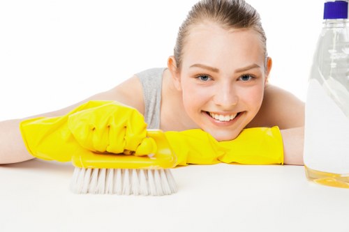 Professional cleaner maintaining stairwell in Ilford